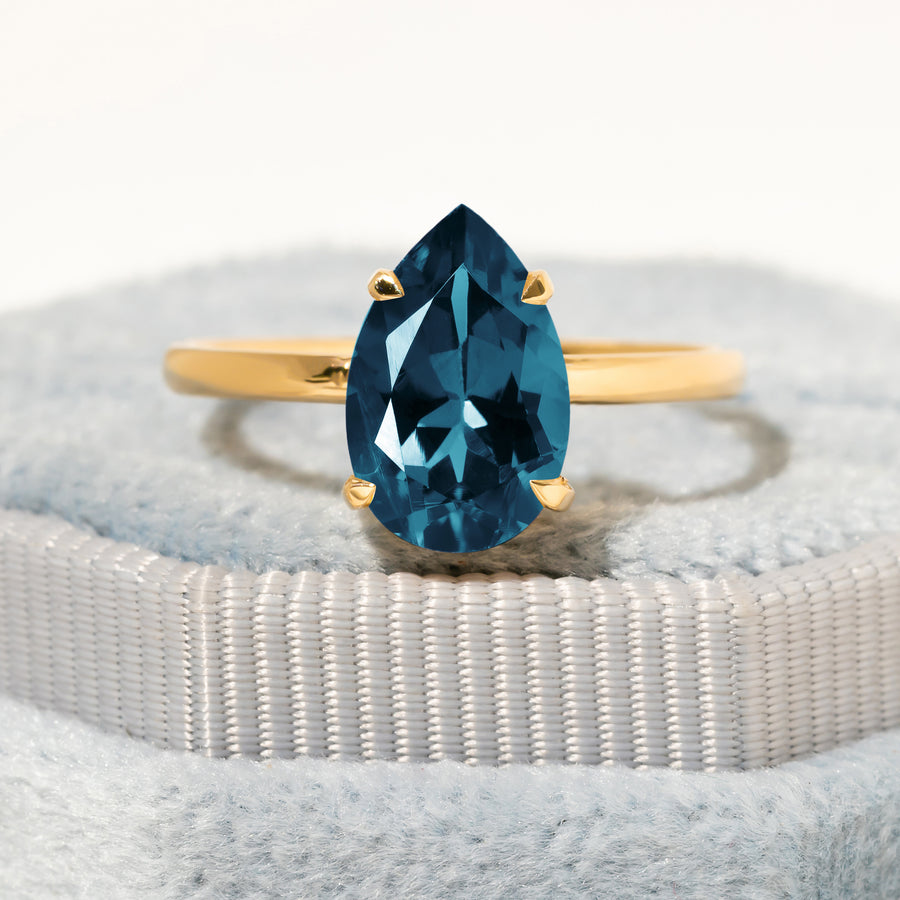 Cameo Teardrop Blue Topaz Solitaire Ring