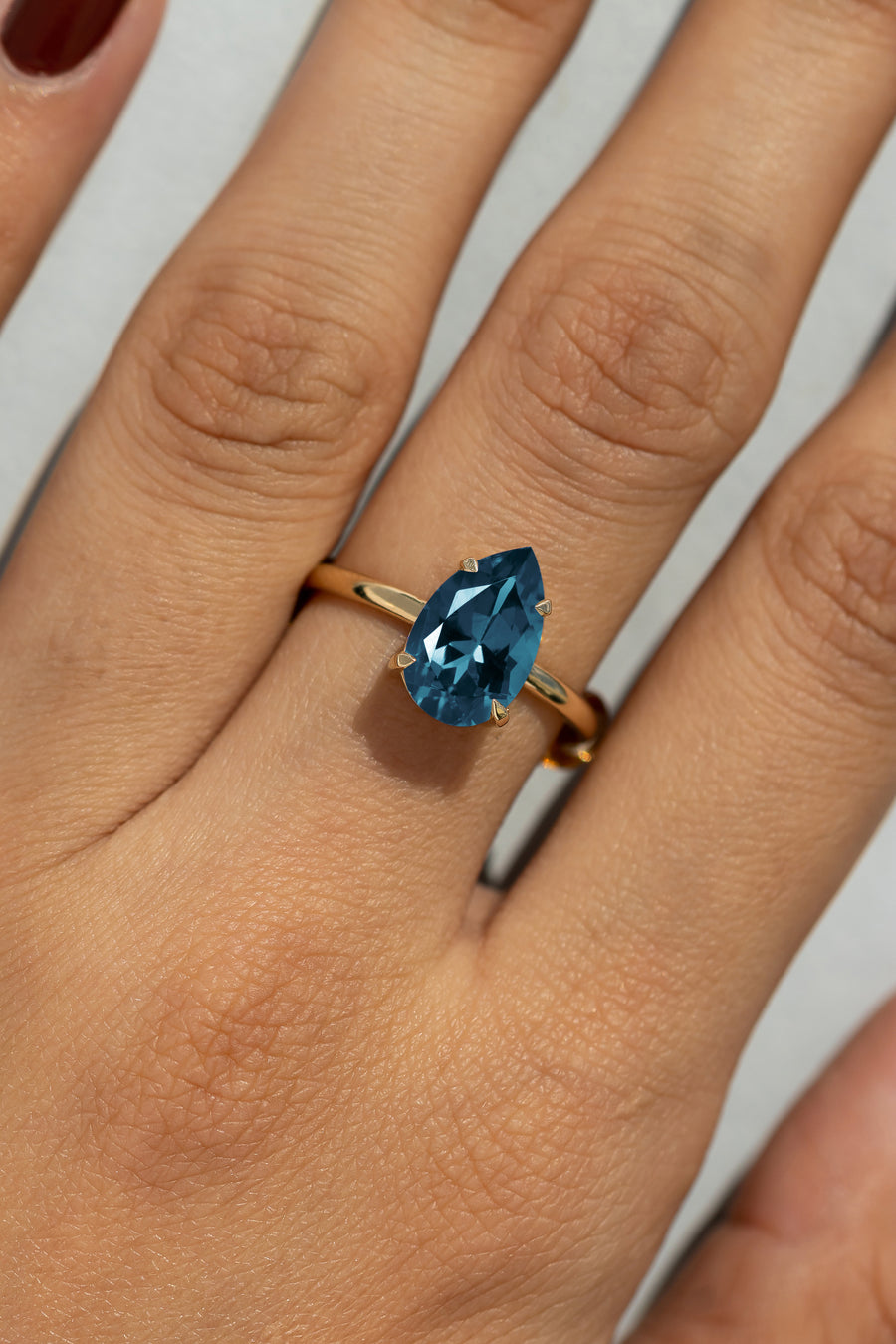 Cameo Teardrop Blue Topaz Solitaire Ring