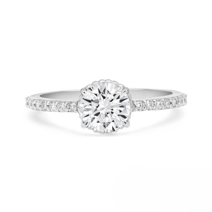 Dainty bridal moissanite ring with prong setting and diamond accents