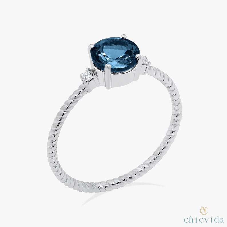 Elegant 14k gold promise ring with London Blue Topaz