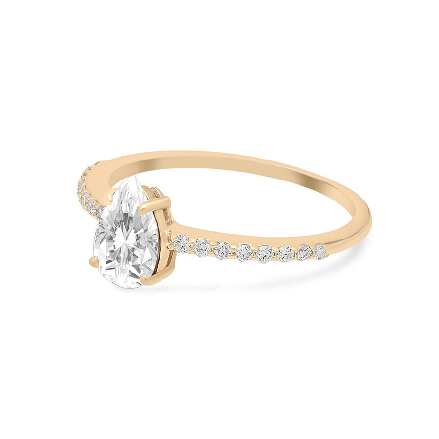 Handmade jewelry piece featuring dainty pear moissanite in gold setting
