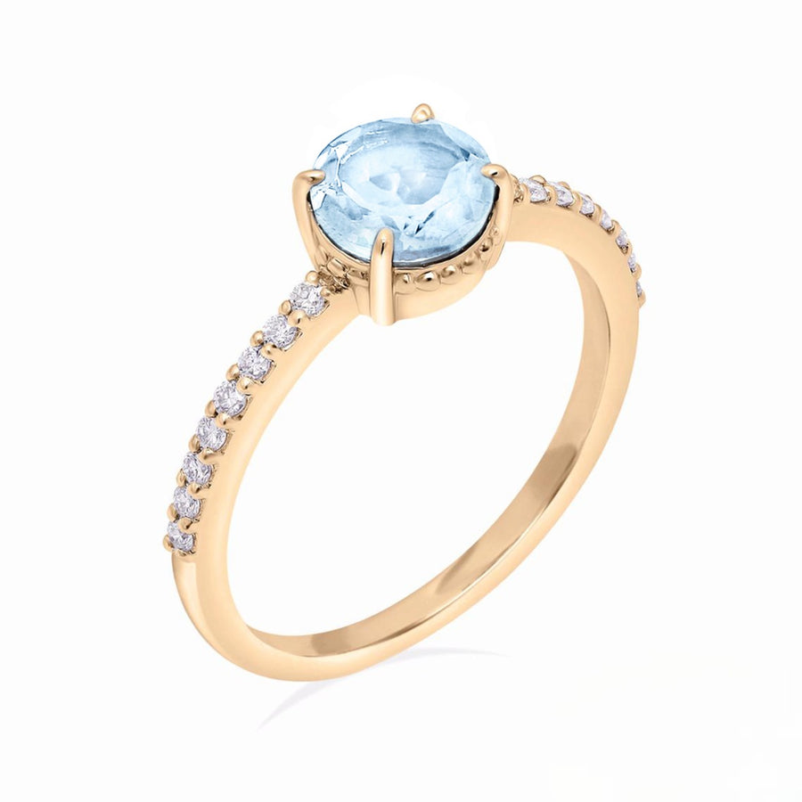 Minimalist aquamarine proposal ring in gold with pavé diamonds