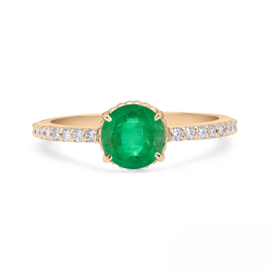 Round emerald engagement ring with diamond band in yellow gold