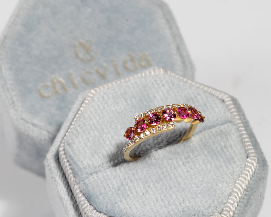 Pink tourmaline anniversary ring in yellow gold with diamond accents