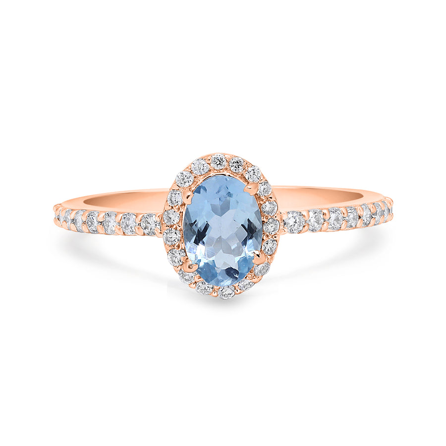 Dainty ring featuring aquamarine and diamond halo in bridal style