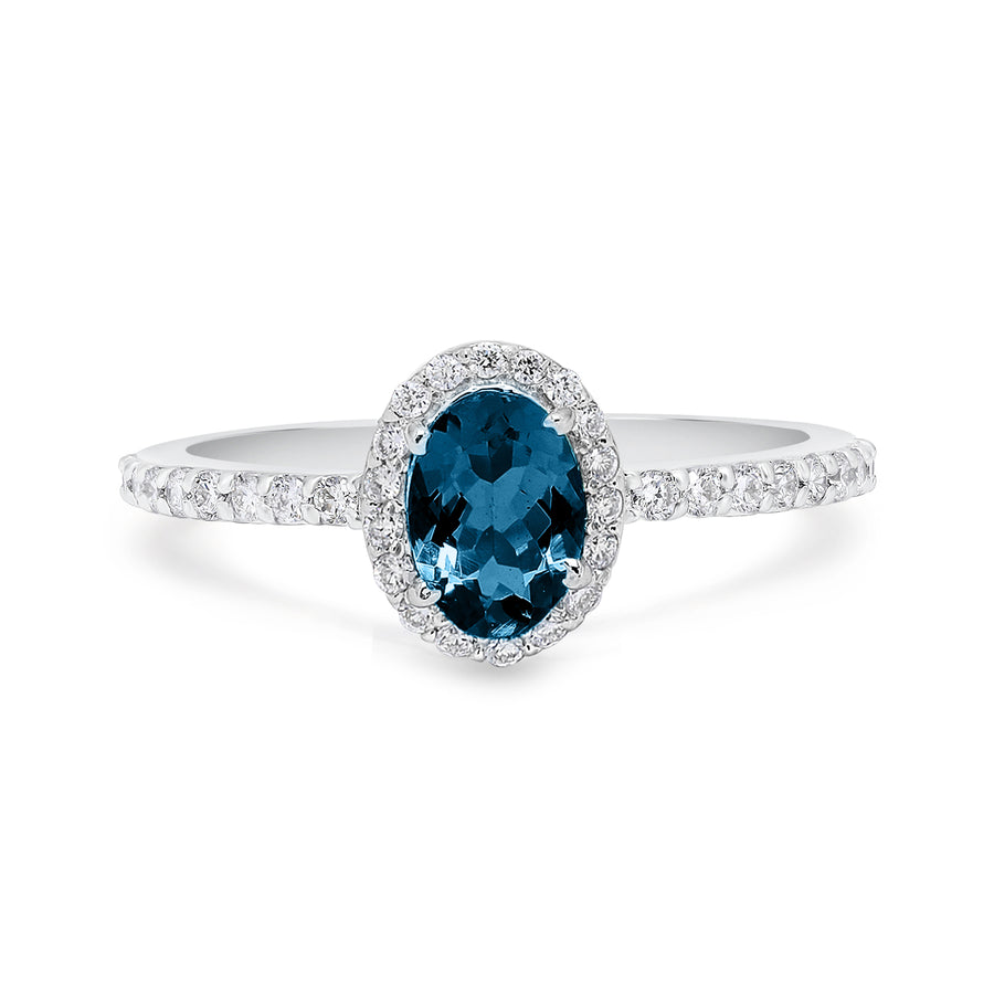 Dainty ring with oval topaz and pavé diamond band in yellow gold