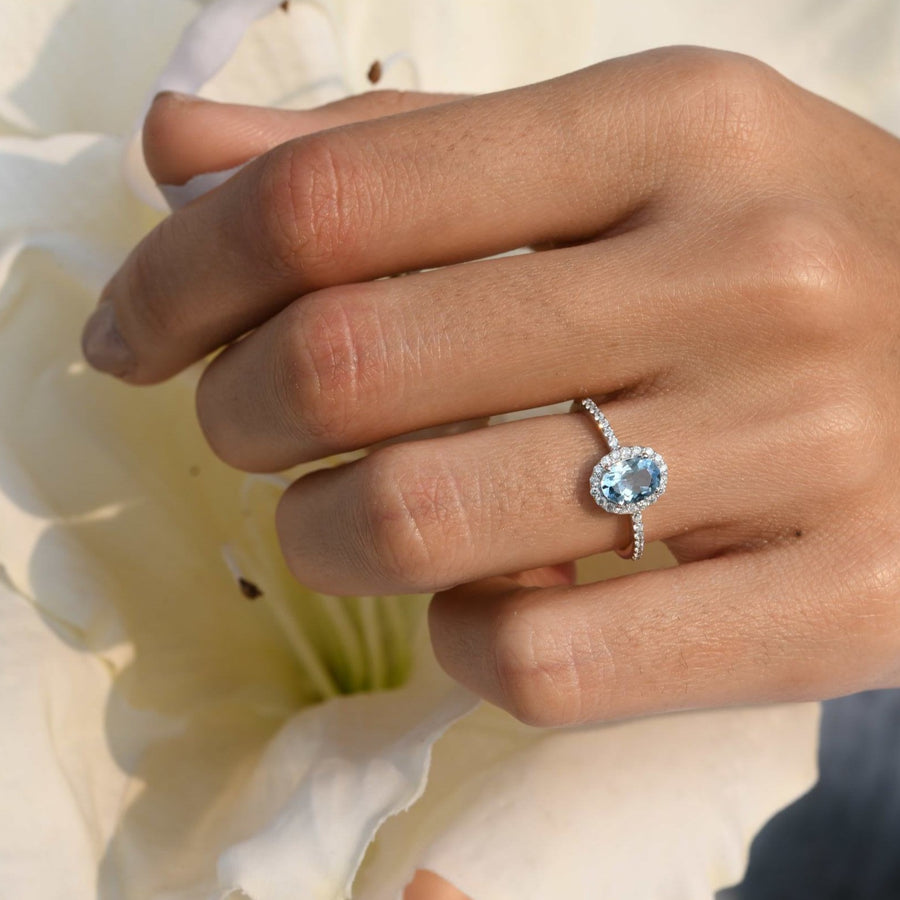 Fine jewelry piece with oval aquamarine and diamond accents"
