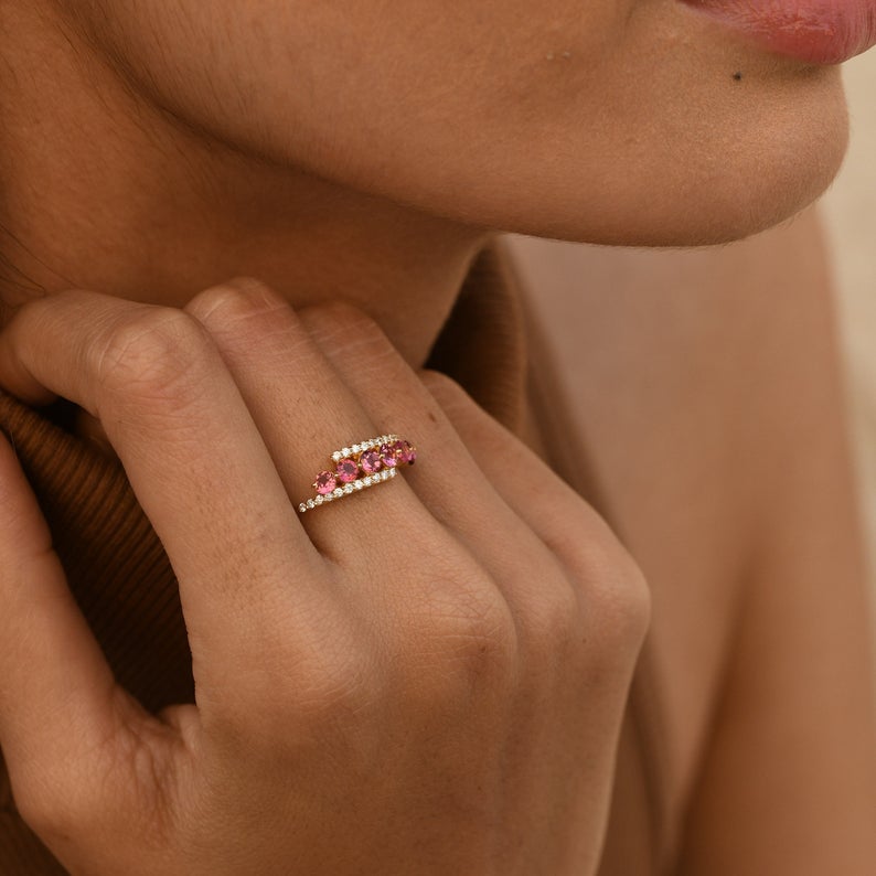 Fine jewelry gift ring with pink gemstones and pavé diamonds