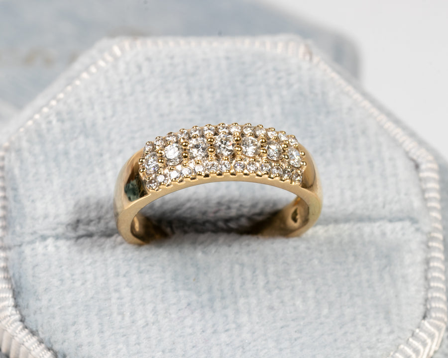 Halo wedding band with three rows of diamonds