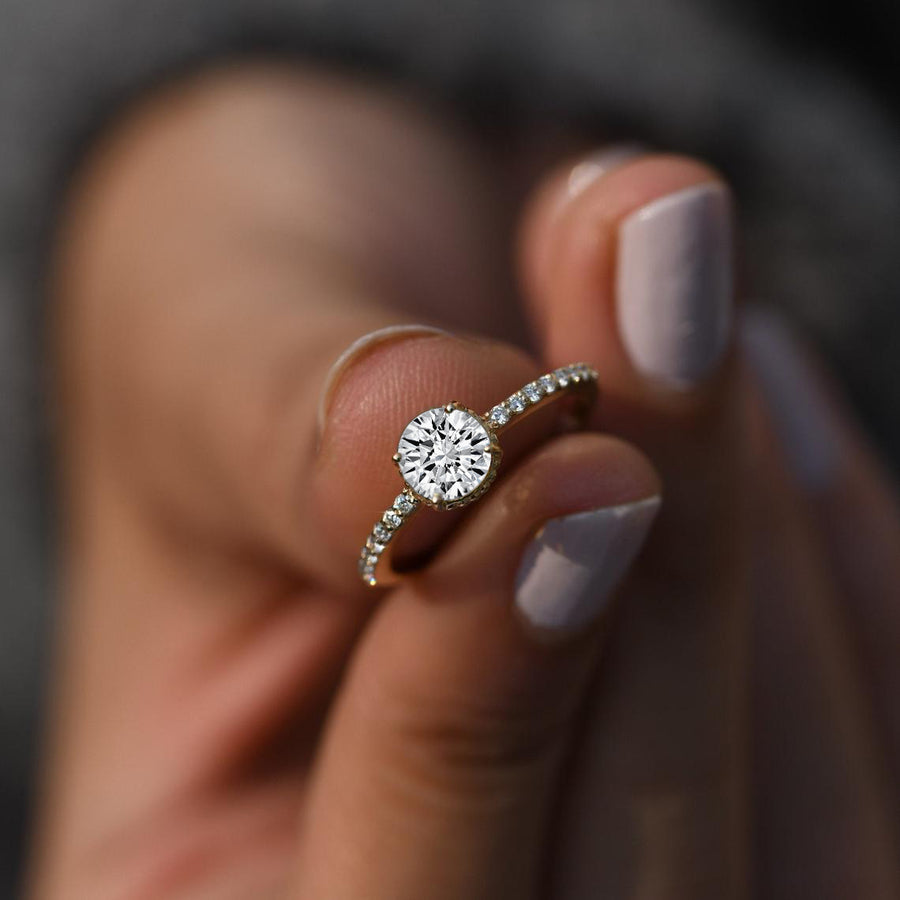 Handmade moissanite engagement ring with diamonds in 14k gold