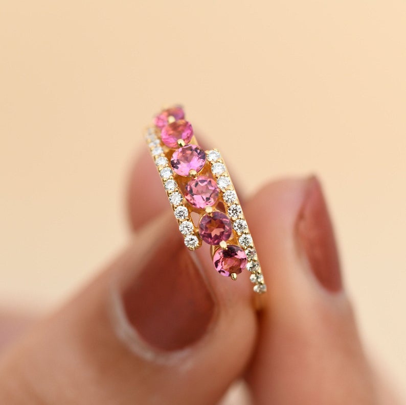 Handmade statement ring with pink tourmalines and diamond bands