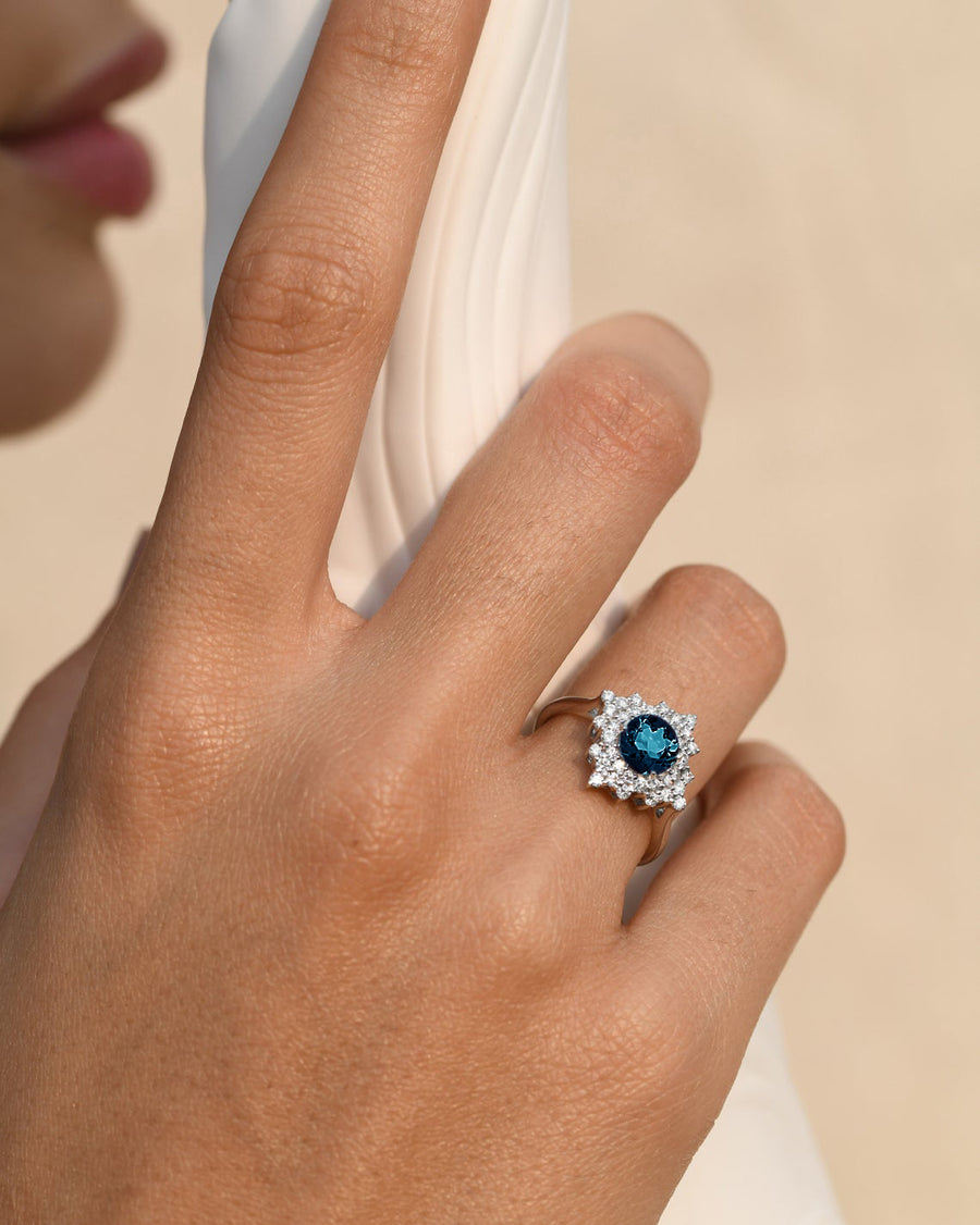 Stellar London Blue Topaz Ring with a Diamond Halo
