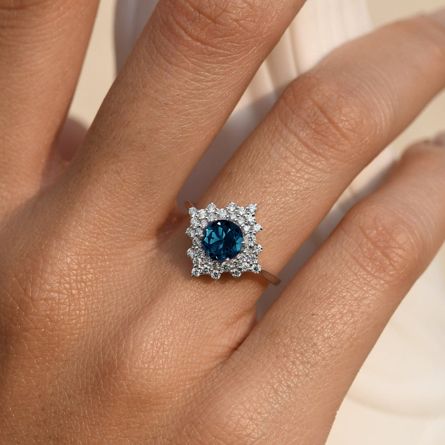 Stellar London Blue Topaz Ring with a Diamond Halo
