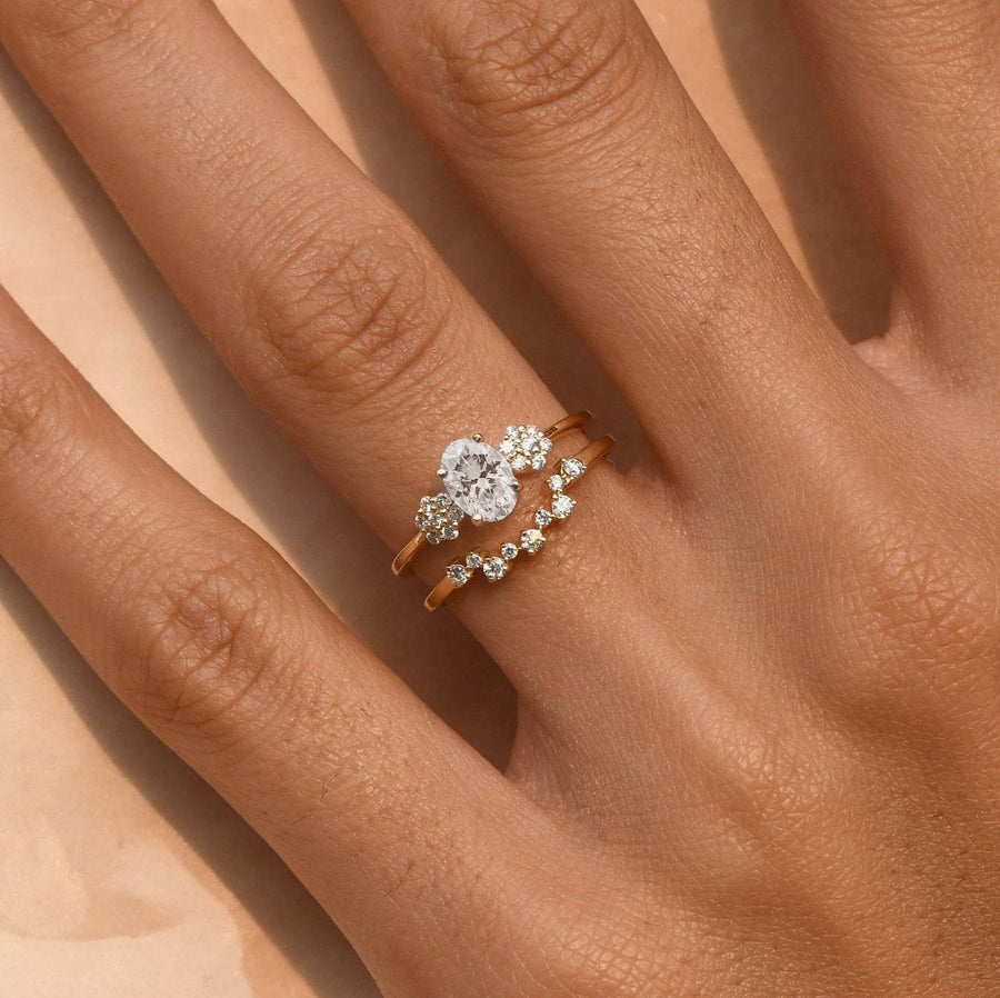 Prong-set moissanite bridal ring with side diamond clusters