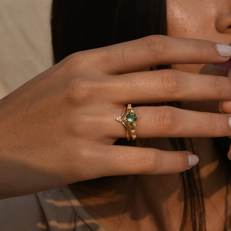 Vintage-inspired gemstone ring with pear and round diamond accents